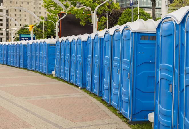 portable restrooms lined up at a marathon, ensuring runners can take a much-needed bathroom break in Clio